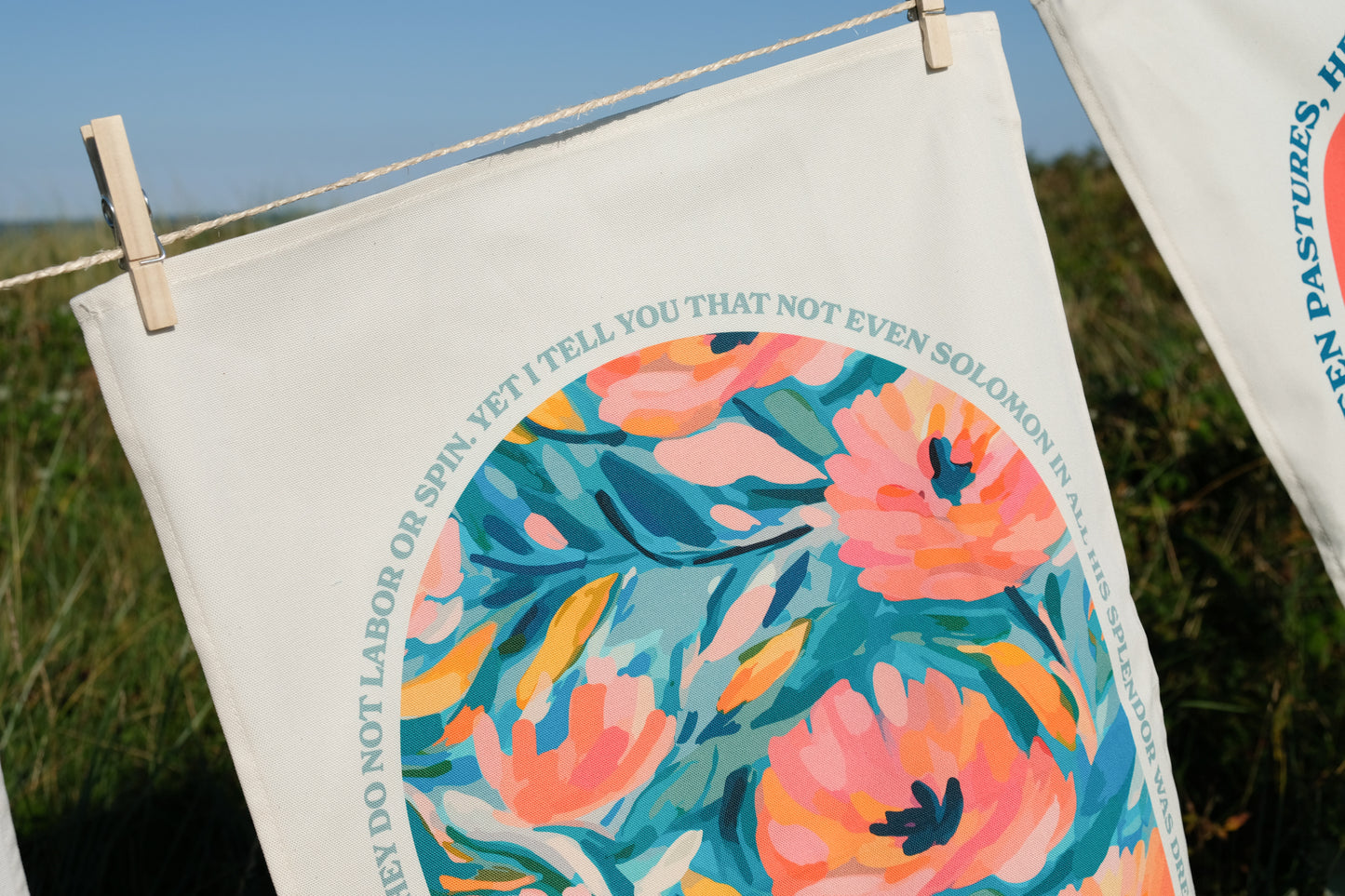 Organic cotton Christian tea towel. Matthew 6. Look at the flowers.
