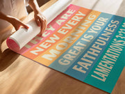 Colorful poster featuring the text 'Great is your faithfulness, Lamentations 3:22-23' on a wooden surface.