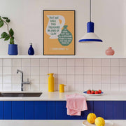 Wall art featuring the text 'We Have This Treasure In Jars of Clay' with a modern design, displayed in a kitchen setting.