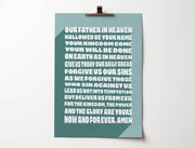 Green poster featuring the Lord's Prayer in bold white text, clipped to a wall.