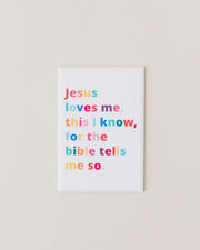 Magnet with colorful text reading 'Jesus loves me, this I know, for the bible tells me so' on a white background