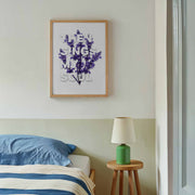 Framed poster with the text 'THEN SINGS MY SOUL' in purple, displayed on a wall above a bed with blue bedding.
