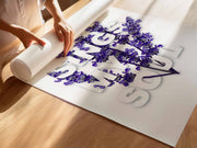 Purple floral design with the text 'Then sings my soul' on a white background, rolled on a wooden table.