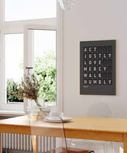 Act justly, love mercy, walk humbly — Micah 6:8 charcoal-grey flip-board poster, biblical wall art mockup.