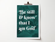 Poster featuring the text 'Be still & know that I am God' on a dark green leaf background.