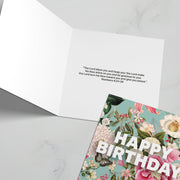 Birthday greeting card featuring floral design and the text 'Happy Birthday' on the front, with a bible verse inside.