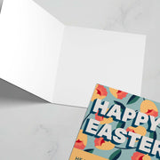 Easter greeting card featuring colorful flowers and the text 'HAPPY EASTER' on the front, blank inside.
