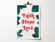 Poster featuring the words 'Faith Hope Love' in red, surrounded by green leaves on a light background