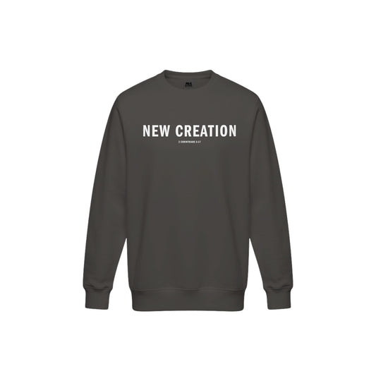 Dark gray sweater featuring the text 'NEW CREATION' in bold white letters across the front.