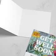 Get well soon card featuring floral design and a bible verse inside, with a blank white interior.