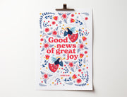 Poster featuring the text 'Good news of great joy' with floral and angel designs, scripture reference Luke 2:10.