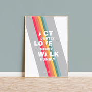 Poster featuring the text 'Act Justly, Love Mercy, Walk Humbly' with colorful stripes and a minimalist design.