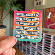 Eco-vinyl sticker featuring the text of Isaiah 55:12 in colorful, bold fonts, held by a hand.