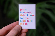 Magnet featuring the text 'Jesus loves me, this I know, for the bible tells me so' in colorful letters.