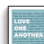 Poster featuring the text 'Love one another' with a bible verse, framed in black and white.