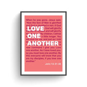 Coral poster with white text featuring the quote 'Love one another' and John 13:31-35, framed in black.