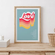 Colorful poster featuring the word 'Love' in bold, wavy letters with a light blue background and scripture reference.