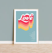 Colorful poster featuring the word 'Love' in bold, wavy letters with a bible verse from 1 Corinthians 13 below.