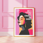 Proverbs 31:25a poster featuring a woman with long hair against a pink background, framed in gold.