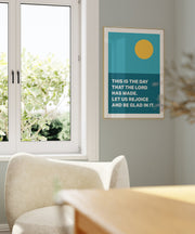 Poster with a yellow circle and text: 'THIS IS THE DAY THAT THE LORD HAS MADE. LET US REJOICE AND BE GLAD IN IT.