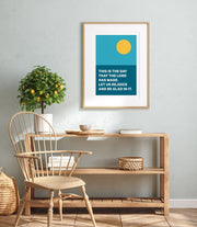 Poster with a blue background and yellow sun, featuring the text 'This is the day that the Lord has made. Let us rejoice and