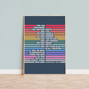 Poster featuring Romans 8:38-39 in colorful stripes on a dark background, framed and displayed on a wall.