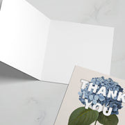Thank you' greeting card featuring a hydrangea illustration, blank inside, with a light background.