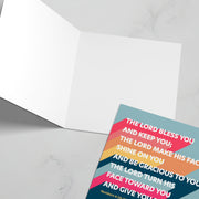 Greeting card featuring colorful text of Numbers 6:24-26 with a blank interior.