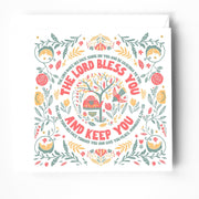 Greeting card featuring floral design and the bible verse Numbers 6:24-26 in colorful typography.