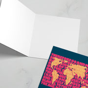 Christian greeting card featuring a world map and the text from Matthew 28, with a blank interior.