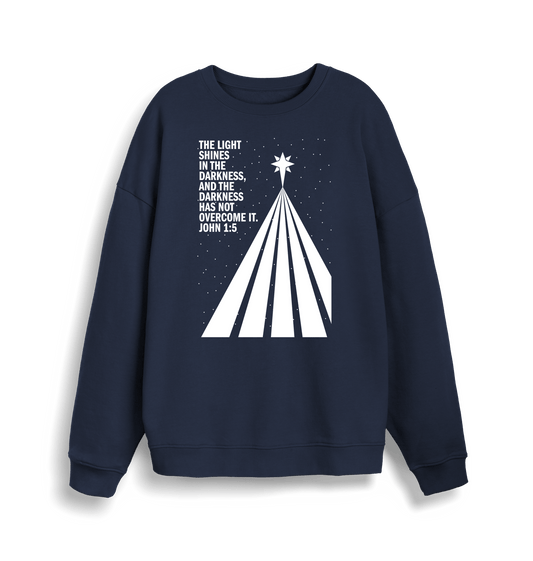 The light shines in the darkness. Unisex organic cotton sweater - The Christian Poster Company