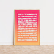 Poster featuring The Lord's Prayer in gradient pink to orange, framed, suitable for wall art.