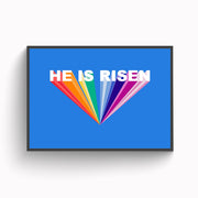 Colorful poster featuring the text 'HE IS RISEN' in bold white letters on a blue background.