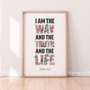 Framed poster with the text 'I AM THE WAY, AND THE TRUTH AND THE LIFE' in colorful floral letters, scripture reference at