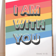 Poster featuring the text 'I AM WITH YOU' in bold letters on a colorful striped background, with 'ISAIAH 41:10' at the